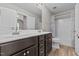 Bathroom features a double sink vanity, framed mirror, and shower-tub combo at 870 Kentucky Derby Ln, Lillington, NC 27546