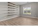 Bright room features hardwood floors, shelving, and natural light at 870 Kentucky Derby Ln, Lillington, NC 27546