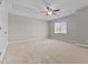 Bright bedroom features neutral paint, carpet, ceiling fan, and natural light at 870 Kentucky Derby Ln, Lillington, NC 27546