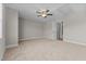 This is a large bedroom featuring a ceiling fan, and carpet flooring with an ensuite bathroom at 870 Kentucky Derby Ln, Lillington, NC 27546