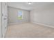 This bedroom features neutral paint, carpet, and natural light at 870 Kentucky Derby Ln, Lillington, NC 27546
