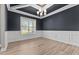 Dining room with coffered ceiling, modern light fixture, and large window at 870 Kentucky Derby Ln, Lillington, NC 27546