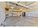Unfinished garage interior with shelving and a refrigerator at 870 Kentucky Derby Ln, Lillington, NC 27546
