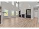 Bright living room features high ceilings, fireplace, built-in shelving, and hardwood floors at 870 Kentucky Derby Ln, Lillington, NC 27546