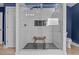 Modern bathroom shower featuring white subway tile, a bench, black tiled flooring, and glass doors at 870 Kentucky Derby Ln, Lillington, NC 27546