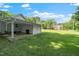 Enjoy the spacious backyard with convenient covered parking and storage buildings, ideal for outdoor living at 8733 Crowder Rd, Raleigh, NC 27603