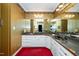 Bathroom featuring dual sinks with vanity and mirrored wall at 8733 Crowder Rd, Raleigh, NC 27603