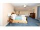 Cozy bedroom featuring soft carpeting, a ceiling fan, and a comfortable bed, creating a serene retreat at 8733 Crowder Rd, Raleigh, NC 27603