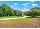 Well-maintained brick home with an ample front yard and circular driveway at 8733 Crowder Rd, Raleigh, NC 27603
