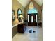 Grand foyer with marble floors, statement lighting, and a decorative console table at 8733 Crowder Rd, Raleigh, NC 27603