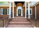 Elegant brick entrance with stately columns and a beautiful front door with sidelights at 8733 Crowder Rd, Raleigh, NC 27603