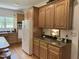 This kitchen features wooden cabinets and countertops and stainless steel appliances at 8733 Crowder Rd, Raleigh, NC 27603