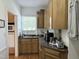 This kitchen area includes a sink, counter, cabinets, and appliances at 8733 Crowder Rd, Raleigh, NC 27603