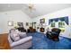 Spacious living room with a fireplace and large windows providing ample natural light at 8733 Crowder Rd, Raleigh, NC 27603