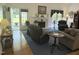 Comfortable living room with plush seating, a fireplace, and access to an outdoor patio area at 8733 Crowder Rd, Raleigh, NC 27603