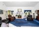 Bright living room with fireplace, large windows, and comfortable seating at 8733 Crowder Rd, Raleigh, NC 27603