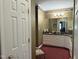 Spacious main bathroom with a vanity, ample cabinet space, and elegant decor at 8733 Crowder Rd, Raleigh, NC 27603