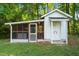Charming outbuilding with screened porch and double door access at 8733 Crowder Rd, Raleigh, NC 27603