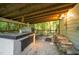 Unique screened-in outdoor grilling area with an impressive stone oven and plenty of wood storage at 8733 Crowder Rd, Raleigh, NC 27603