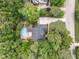 Stunning aerial view of a beautiful home surrounded by lush greenery, featuring a pool and spacious backyard at 91 E Walker Woods Ln, Clayton, NC 27527