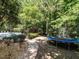 Backyard with paver walkway, pool, hot tub, and trampoline at 91 E Walker Woods Ln, Clayton, NC 27527