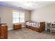 Neutral bedroom features a wood bed with built-in storage, a window and blue LED strip lighting at 91 E Walker Woods Ln, Clayton, NC 27527
