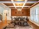 Elegant dining room with coffered ceiling, large windows, and a stylish chandelier at 91 E Walker Woods Ln, Clayton, NC 27527