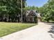 Beautiful two-story brick home with a large front yard and a concrete driveway at 91 E Walker Woods Ln, Clayton, NC 27527