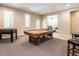 Large game room featuring a pool table and foosball table, perfect for entertainment at 91 E Walker Woods Ln, Clayton, NC 27527