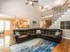 Open living room features soaring ceilings, hardwood floors and comfortable sectional seating with a large rug at 91 E Walker Woods Ln, Clayton, NC 27527
