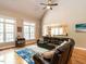Inviting living room featuring vaulted ceilings, large windows, and hardwood floors for a bright and airy feel at 91 E Walker Woods Ln, Clayton, NC 27527