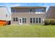 Back of house with spacious yard and a patio at 1005 Fulbright Dr, Morrisville, NC 27560