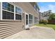 A concrete patio for outdoor enjoyment, complemented by the home's exterior and manicured lawn, creating an inviting space at 1005 Fulbright Dr, Morrisville, NC 27560