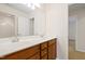 Bathroom with double vanity, large mirror, and doorway to another room at 1005 Fulbright Dr, Morrisville, NC 27560