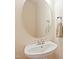 Elegant bathroom features a modern sink with a round mirror and neutral wall color at 1005 Fulbright Dr, Morrisville, NC 27560