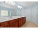 Bathroom featuring double sink vanity with tile flooring and large mirrors at 1005 Fulbright Dr, Morrisville, NC 27560