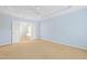 Spacious bedroom with a trey ceiling, carpet, and an open ensuite bathroom at 1005 Fulbright Dr, Morrisville, NC 27560