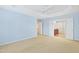 Large carpeted bedroom with doors leading to an upstairs hallway and bathroom at 1005 Fulbright Dr, Morrisville, NC 27560