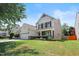 A view of a two-story house featuring a well-maintained lawn and driveway at 1005 Fulbright Dr, Morrisville, NC 27560