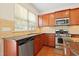 Modern kitchen featuring stainless steel appliances, granite counters, and ample cabinet space at 1005 Fulbright Dr, Morrisville, NC 27560