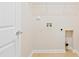 Laundry room with tile floor, white door, and all hookups at 1005 Fulbright Dr, Morrisville, NC 27560
