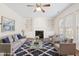 Staged living room with a fireplace, built-ins, and comfortable furniture at 1005 Fulbright Dr, Morrisville, NC 27560