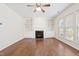 Bright living room with a fireplace, built-in shelving, and large windows at 1005 Fulbright Dr, Morrisville, NC 27560