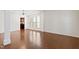 Spacious living area featuring hardwood floors, white trim, and abundant natural light at 1005 Fulbright Dr, Morrisville, NC 27560