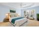 Beautiful staged bedroom with king bed, sitting area, and lots of natural light at 1005 Fulbright Dr, Morrisville, NC 27560