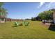 Large backyard featuring a brick patio with a firepit and plenty of space for outdoor activities at 1009 Open Field Dr, Garner, NC 27529
