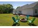 The backyard has a cozy fire pit area with chairs, perfect for outdoor gatherings at 1009 Open Field Dr, Garner, NC 27529