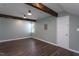 Spacious basement showcasing wood flooring, exposed wood beams, and fresh paint at 1009 Open Field Dr, Garner, NC 27529