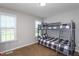This bedroom has a bunk bed and a window to allow lots of natural light at 1009 Open Field Dr, Garner, NC 27529