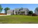 Charming two-story home with a manicured lawn, inviting porch, and attached two car garage at 1009 Open Field Dr, Garner, NC 27529